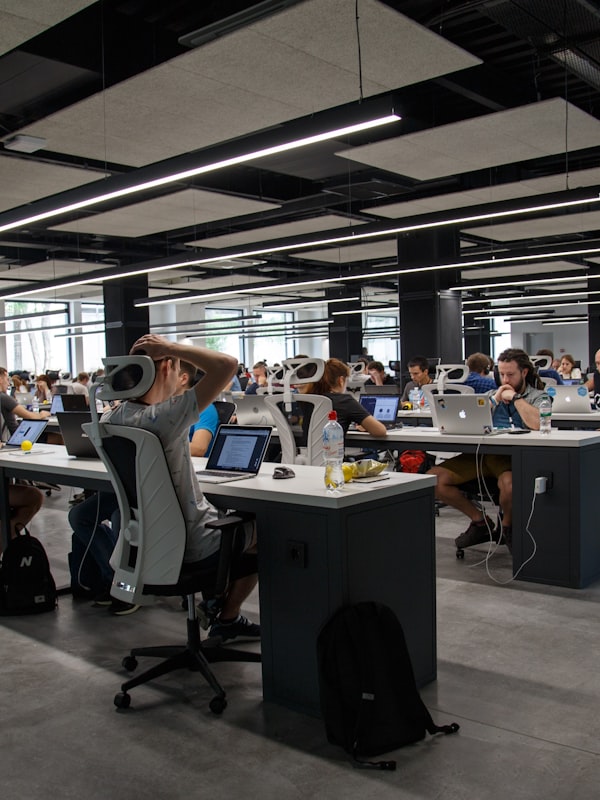 Team collaborating in modern manufacturing workspace